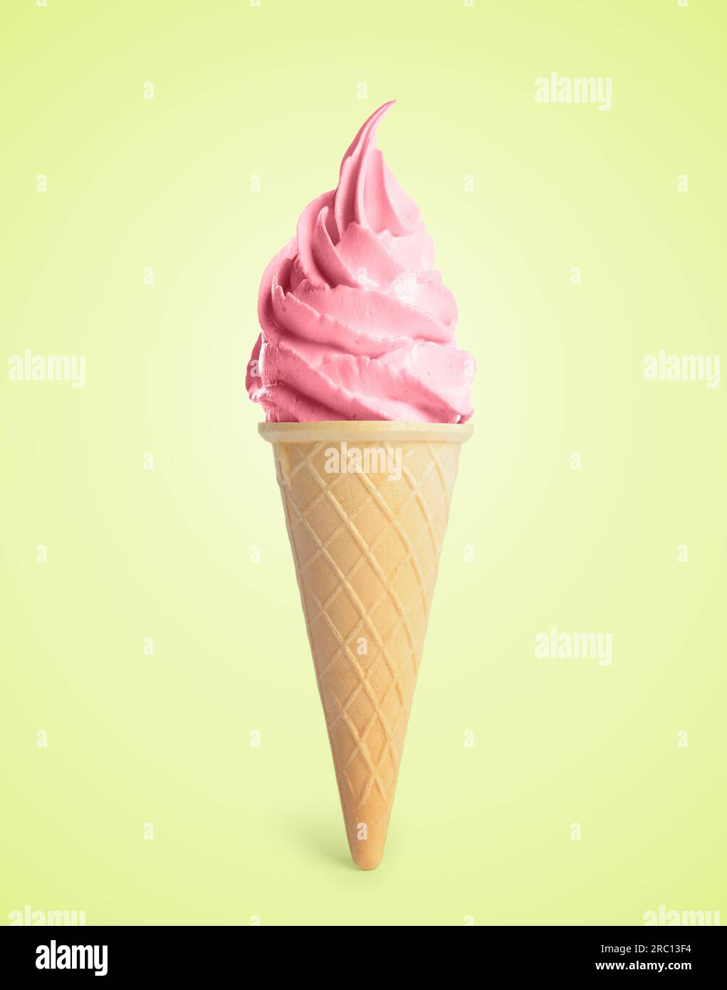 Delicious soft serve berry ice cream in crispy cone on pastel green ...