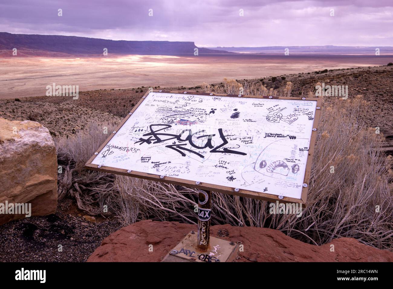 Graffiti fills a roadway sign above a portion of the Colorado Plateau in northern Arizona. Stock Photo
