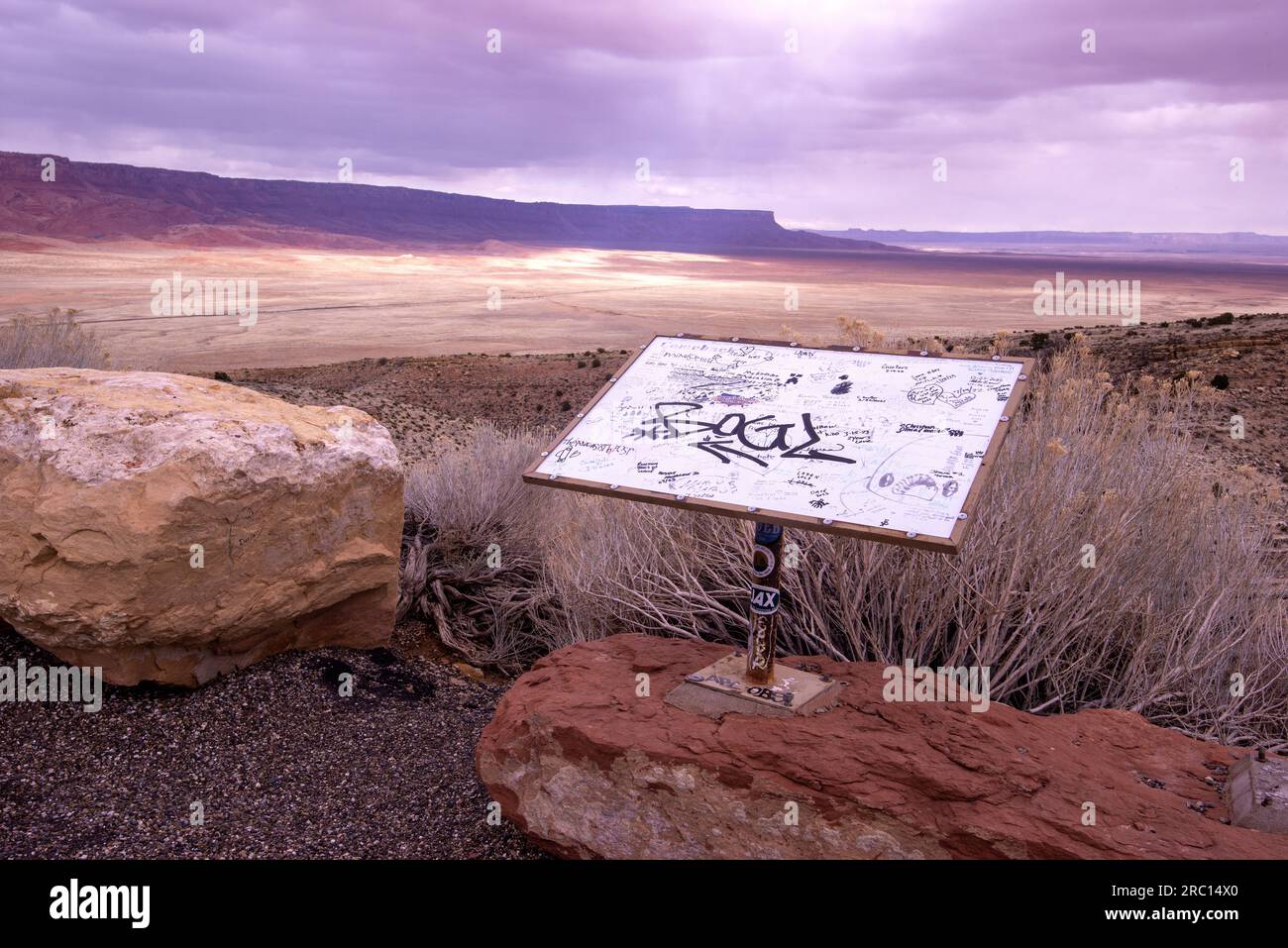 Graffiti fills a roadway sign above a portion of the Colorado Plateau in northern Arizona. Stock Photo