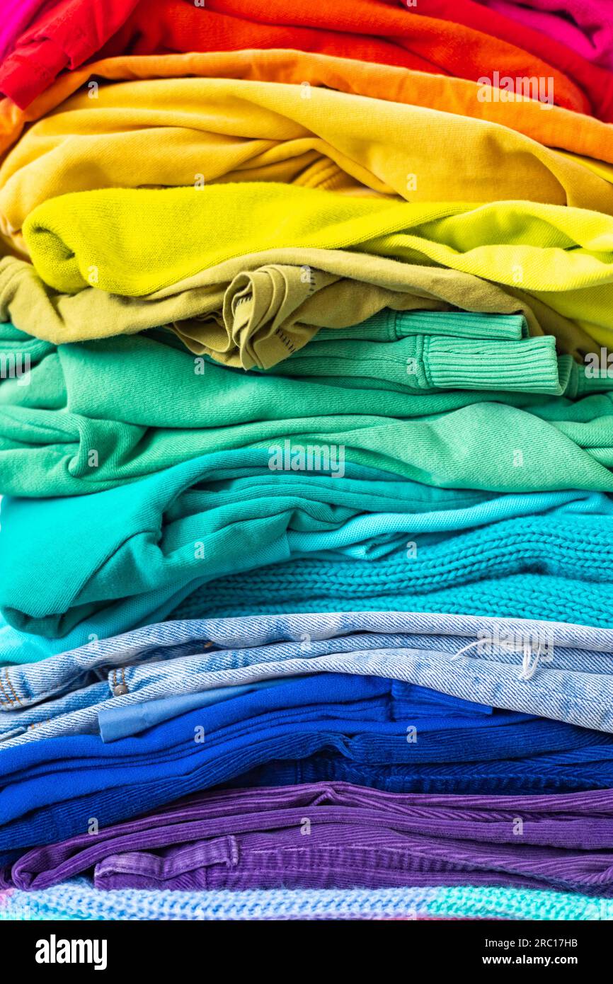 A stack of clothes in different colors. The concept of conscious