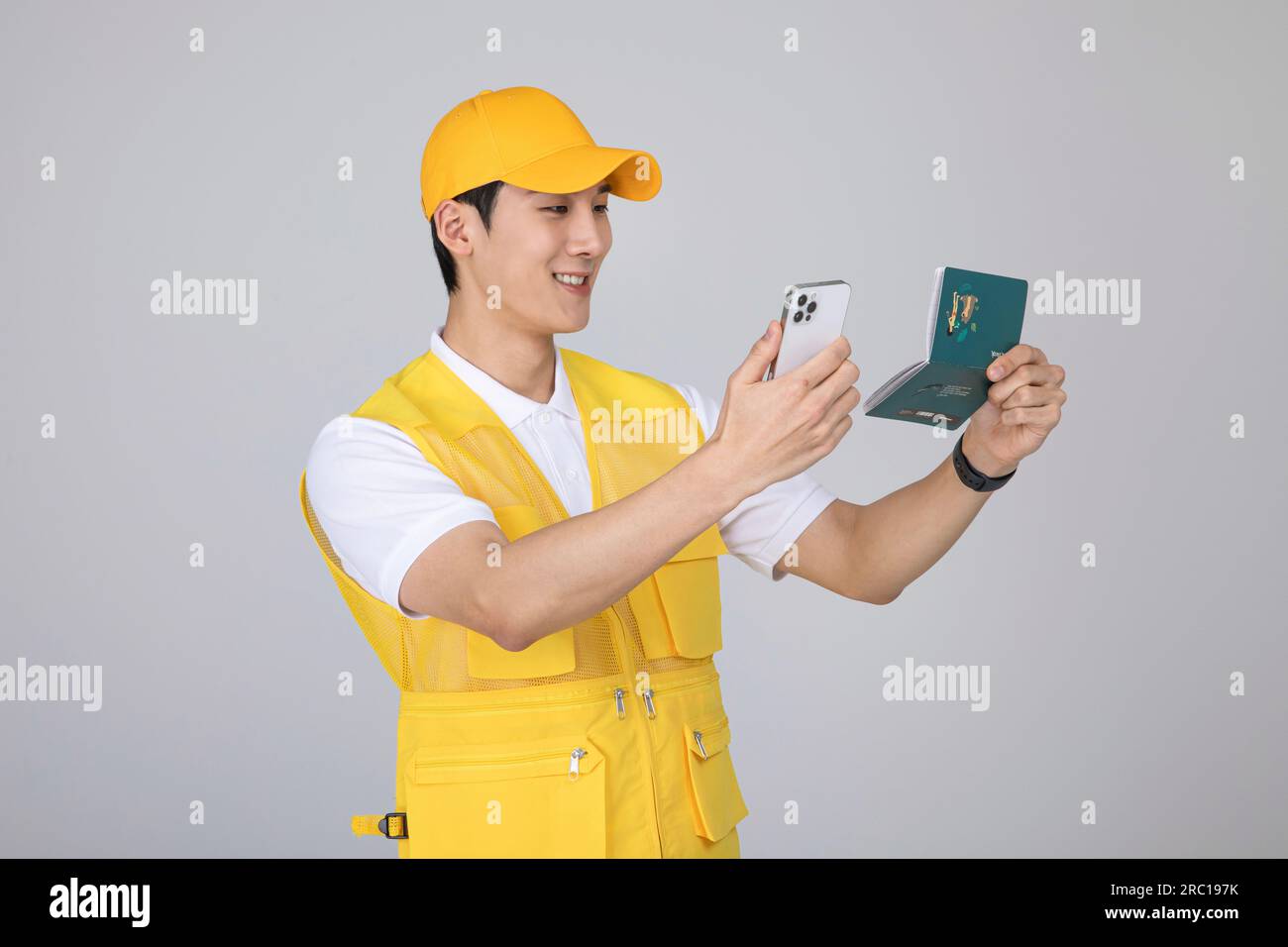 millennials and gen z, korean asian young man holding a bankbook and smartphone Stock Photo