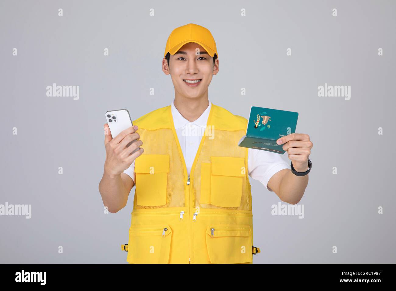 millennials and gen z, korean asian young man holding a bankbook and smartphone Stock Photo