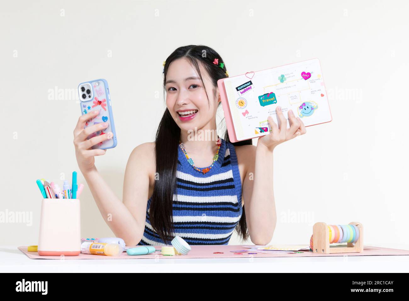 vintage y2k retro concept photo of korean asian cute woman taking selfie of diary decoration with smartphone Stock Photo