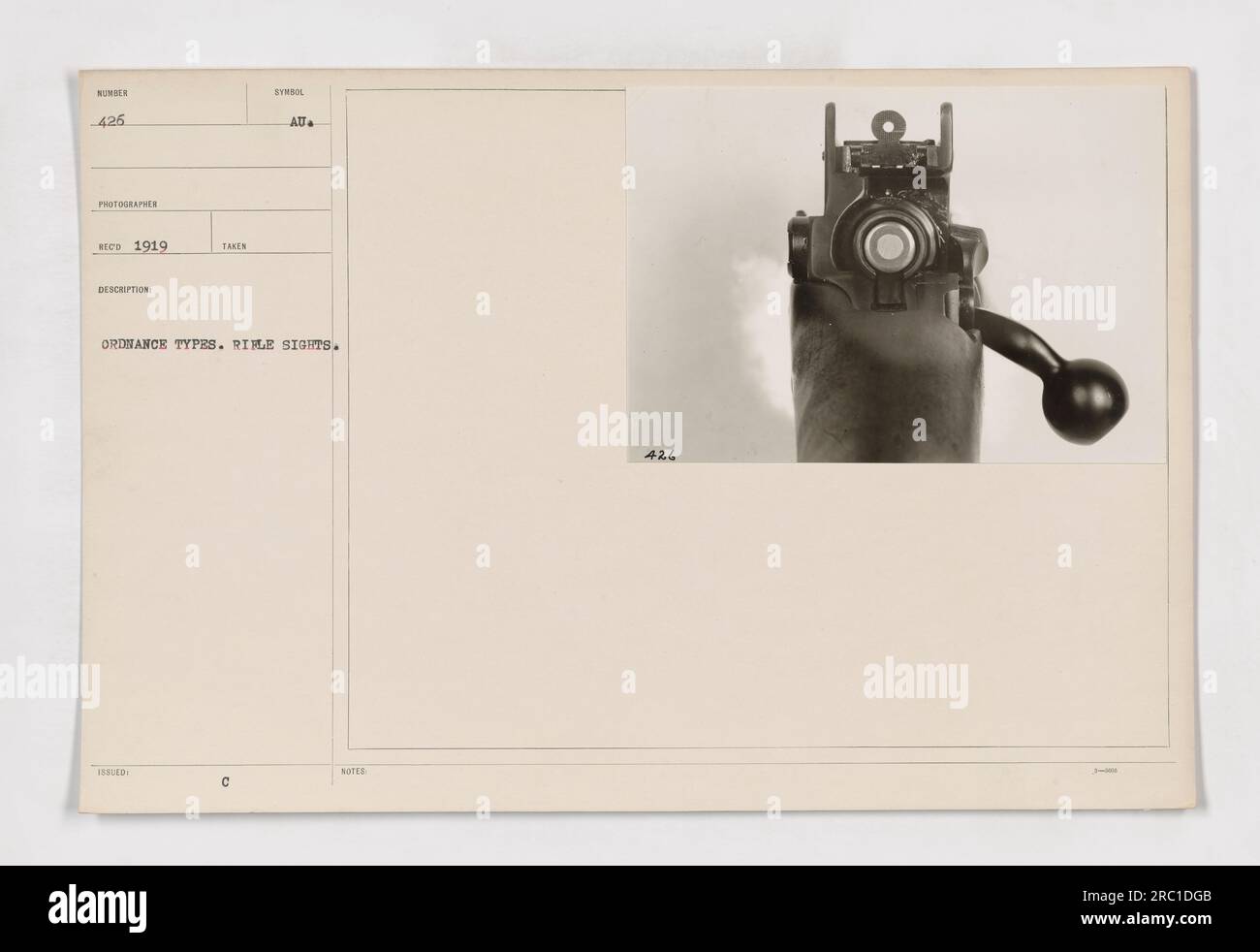 The photograph shows a rifle sight labeled as "under 425." The