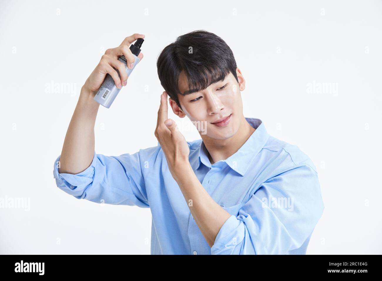korean asian young man using hairspray Stock Photo Alamy