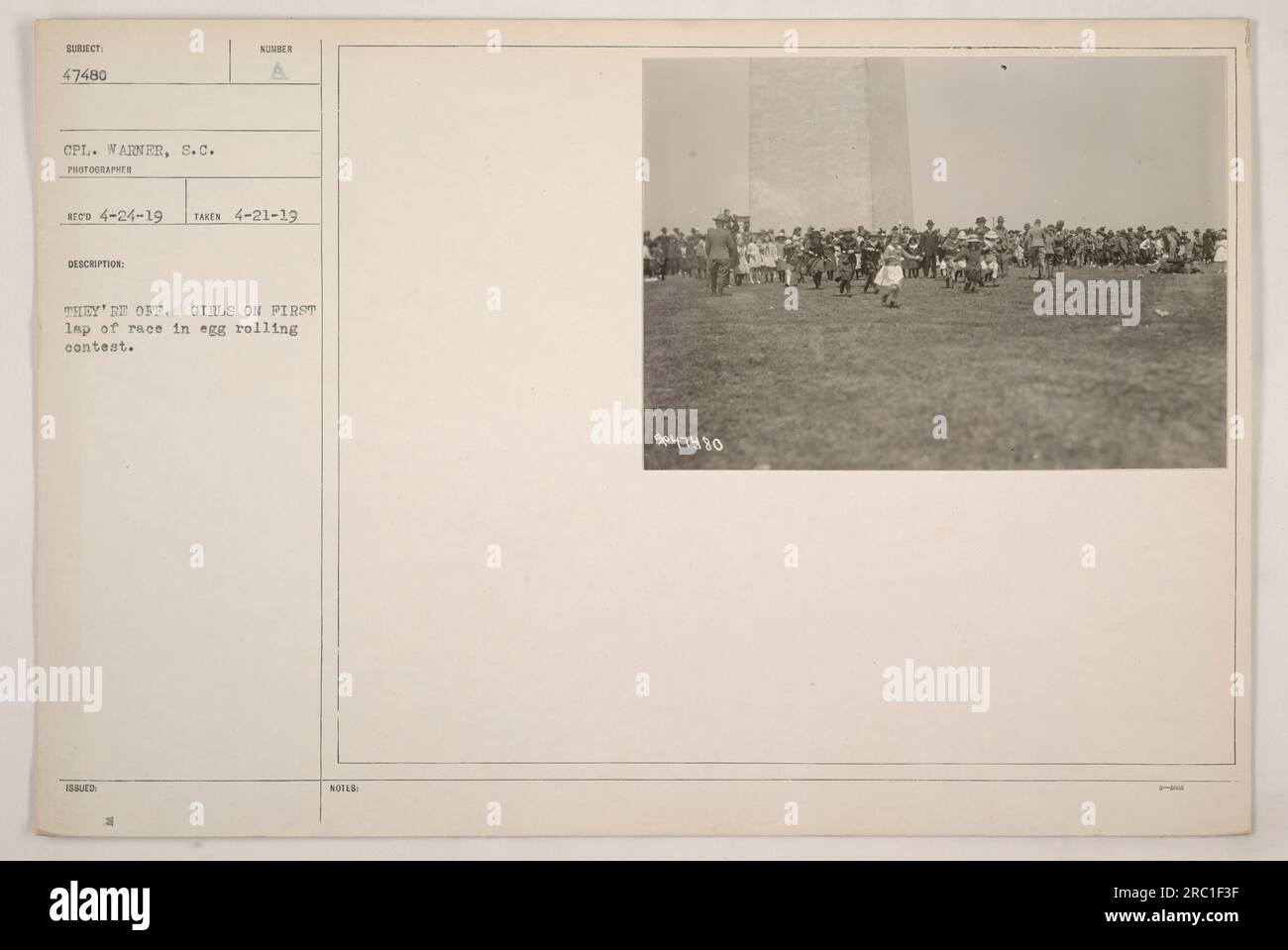 Girls participating in an egg rolling contest are captured in this photograph. The image, taken by 47480 CPL. Warner on April 21, 1919, shows the girls starting their first lap of the race. This description belongs to the collection of photographs documenting American military activities during World War One. Stock Photo