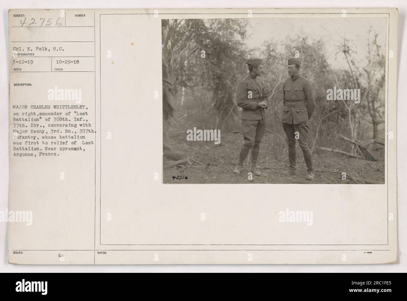 Cpl. K. Polk captures Major Charles Whittlesley, commander of the 'Lost Battalion' of 308th Infantry, 77th Division, conversing with Major Kenny, 3rd Battalion, 307th Infantry. Major Kenny's battalion was the first to provide relief to the Lost Battalion. The photograph was taken near Apremont, Argonne, France. Stock Photo