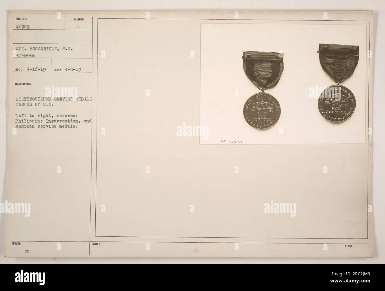 Group of distinguished service medals issued by the U.S. military, photographed by Rico on April 5, 1919. From left to right, the medals on display include the reverse side of the Philippine Insurrection medal and the Mexican service medal. Issued to Sgt. McGarrigle, identified as subject number 46909. Stock Photo