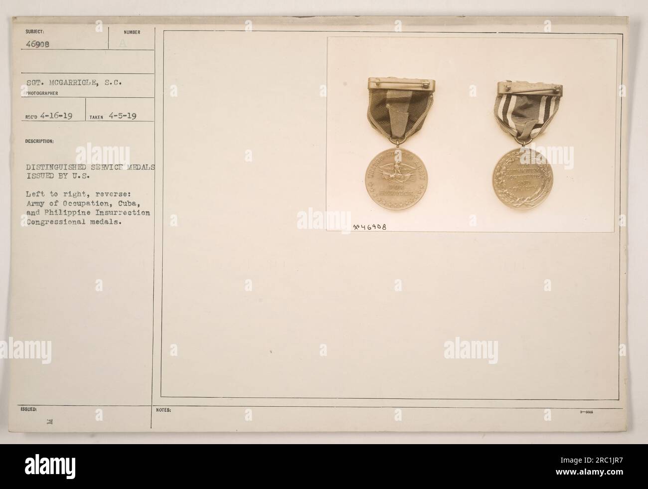 'Awards of 46908 Sgt. McGarricle, S.C., featuring the Distinguished Service Medals issued by the U.S. on April 5, 1919. From left to right, the reverse sides display the Army of Occupation, Cuba, and the Philippine Insurrection Congressional medals. Photo taken by Red on April 16, 1919.' Stock Photo