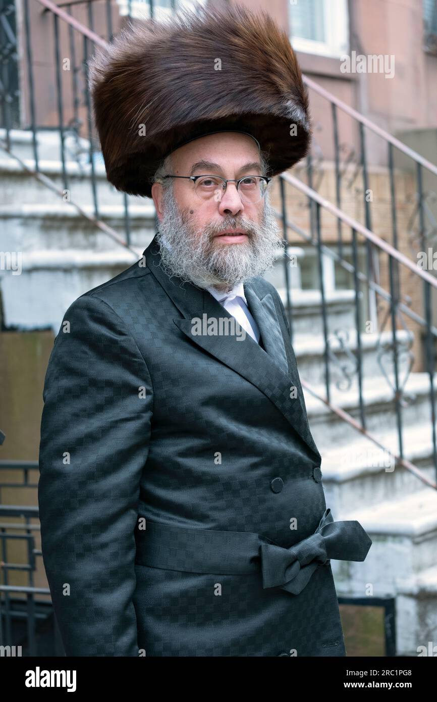 An orthodox Jewish man wearing a shtreimel fur hat during Passover. In Williamsburg, Brooklyn, New York. Stock Photo