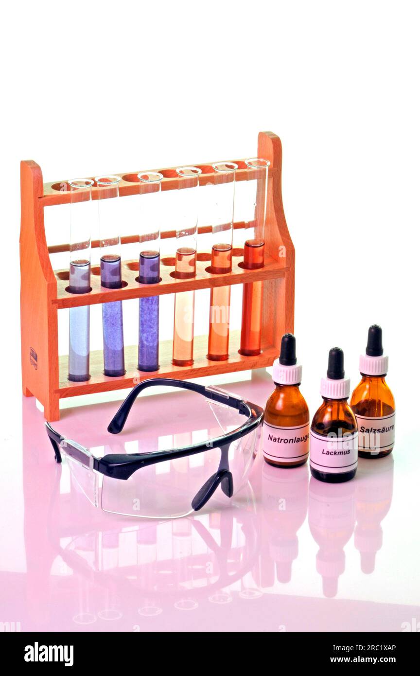Rack with test tubes, glasses, pipette vials with chemicals, litmus