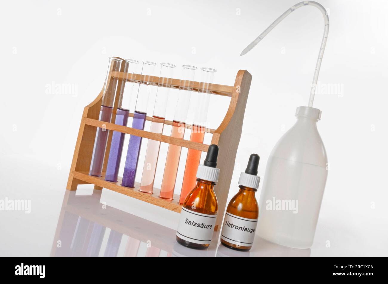 Rack with test tubes, plastic bottle, pipette vials with chemicals