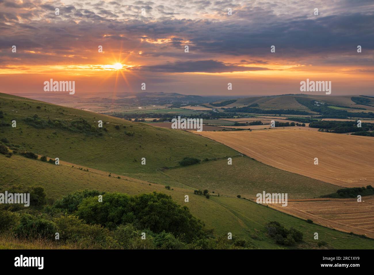 July sunset from Firle beacon on the south downs in east Sussex south east England UK Stock Photo