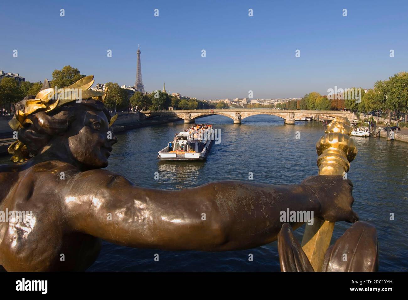 Detail of the Pont Alexandre III bridge, passenger ship on the Seine, Eiffel Tower, Paris, France Stock Photo