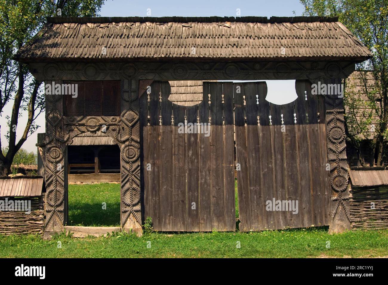 Carving on wooden gate, Ethnographic Museum, Sighetu Marmatiei, Maramures, Romania Stock Photo