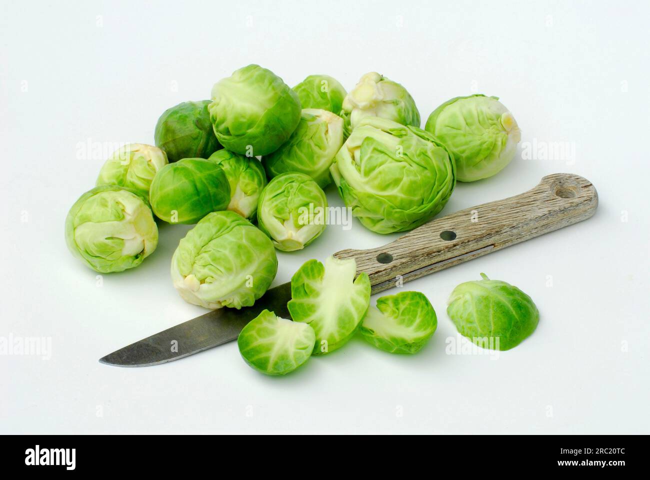 Brussels sprouts and knife (Brassica oleracea var. bullata subvar. gemmifera DC) Stock Photo