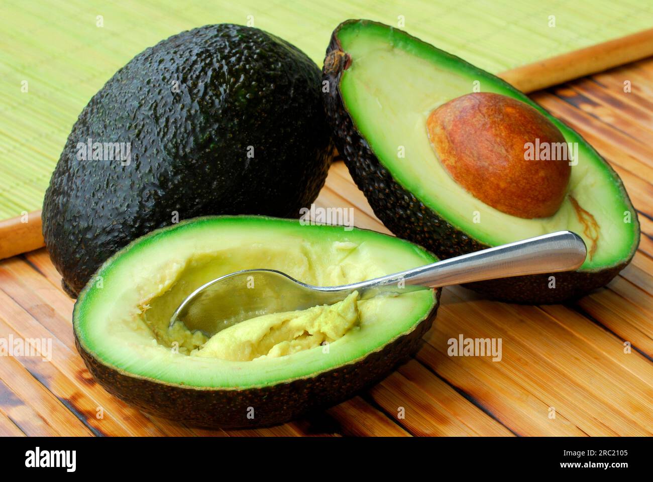 Avocado (Persea americana) sliced, sliced, spoon, Lauraceae (Lauraceae) Stock Photo