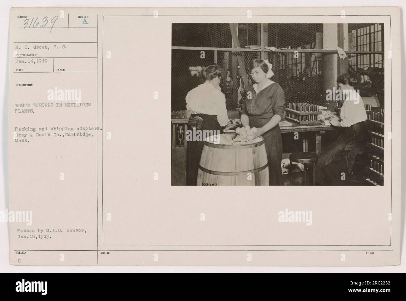 Caption: 'Women workers packing and shipping adapters at Gray & Davis Co. munitions plant in Cambridge, Massachusetts. Photograph taken by M.S. Grost on January 14, 1919 during World War I.' Stock Photo