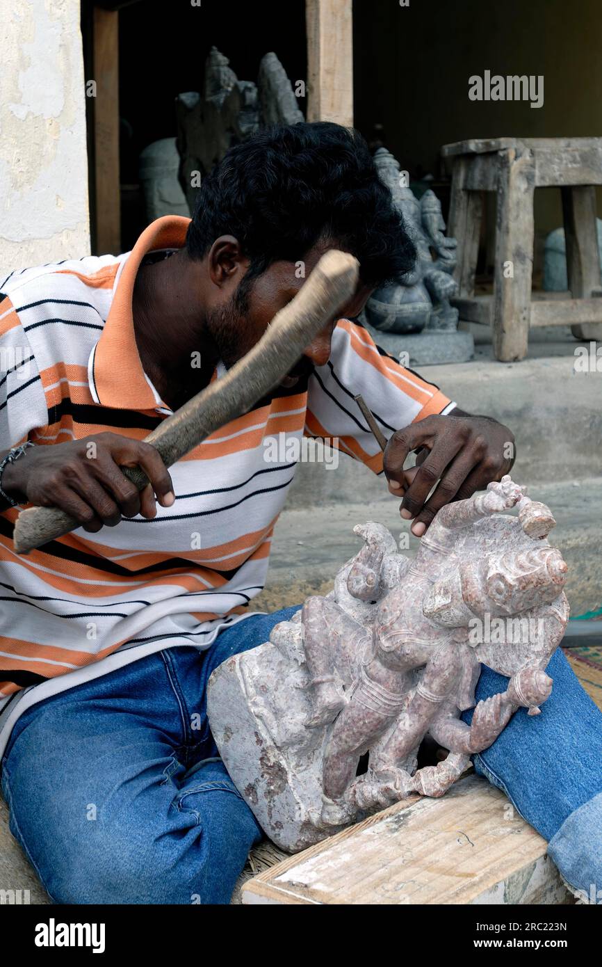A sculptor at work carving a statue in Mahabalipuram Mamallapuram near