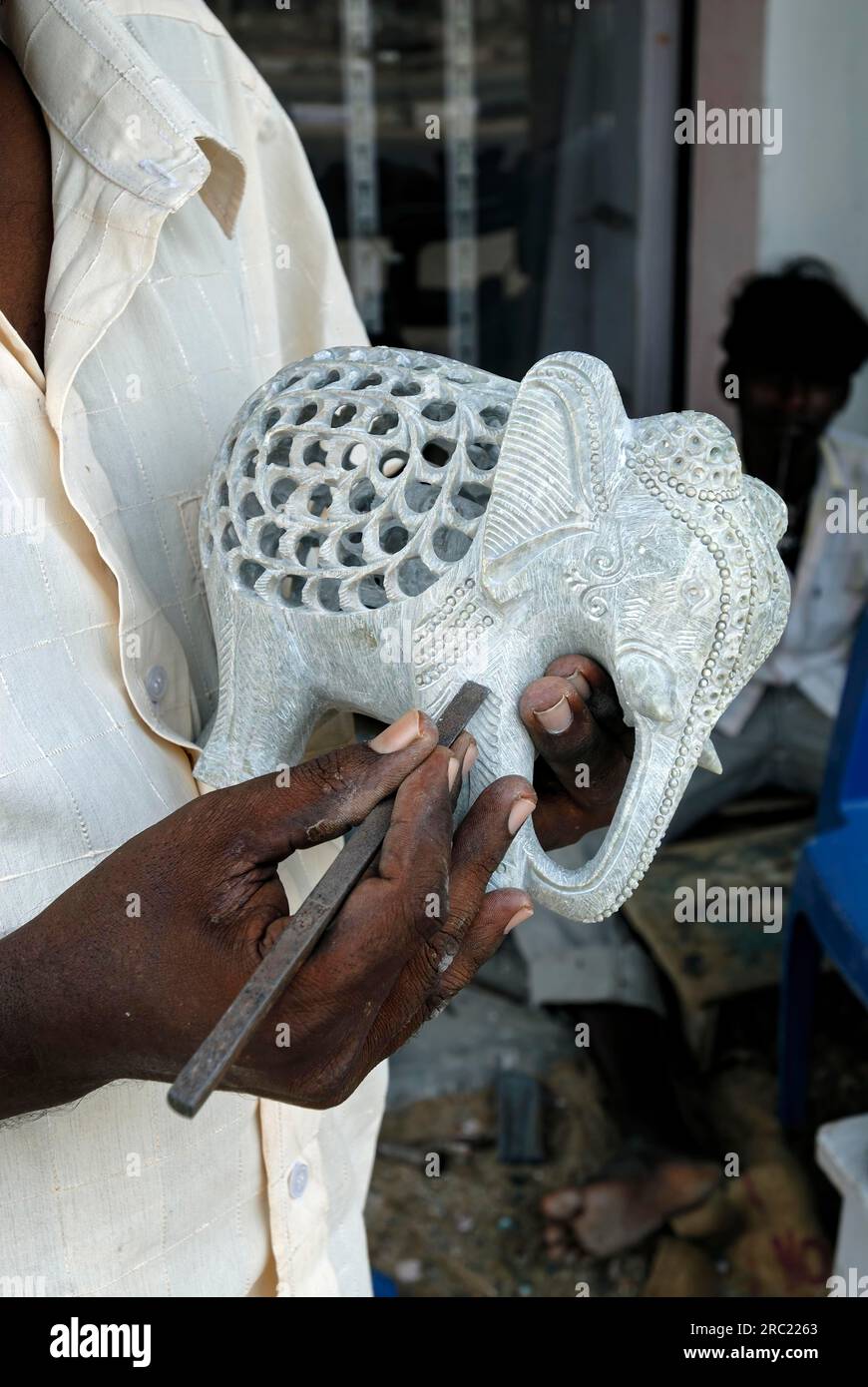 A sculptor at work carving a statue in Mahabalipuram Mamallapuram near