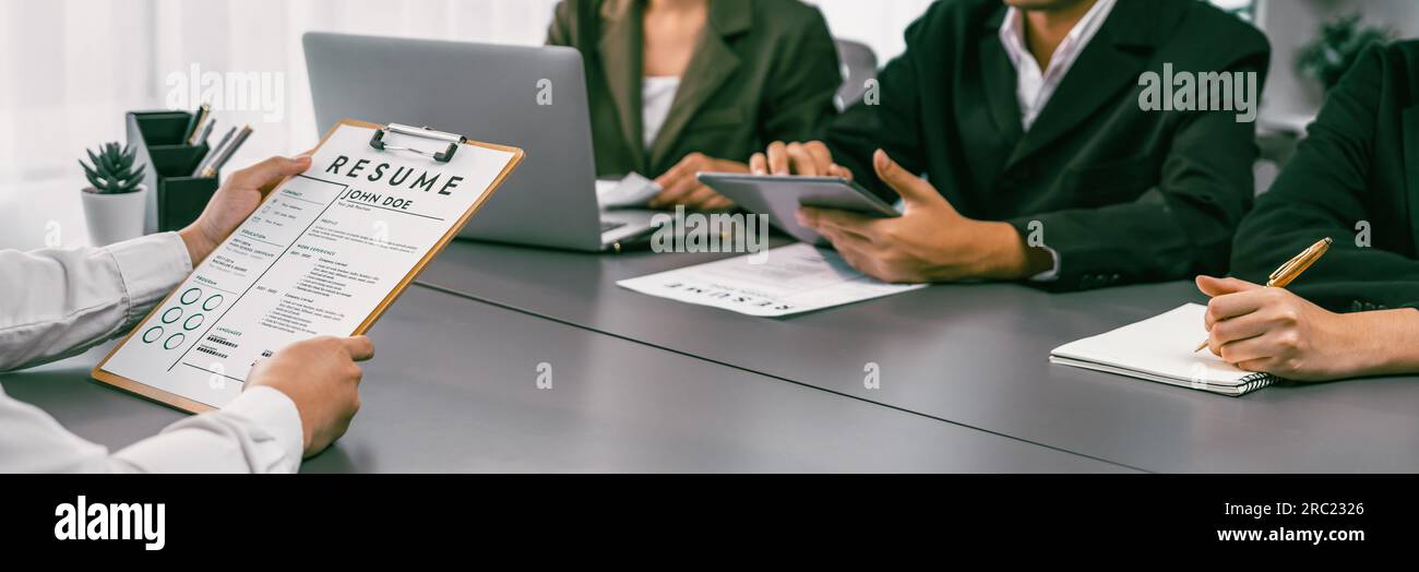 Candidate and interviewers discuss work experience and qualifications