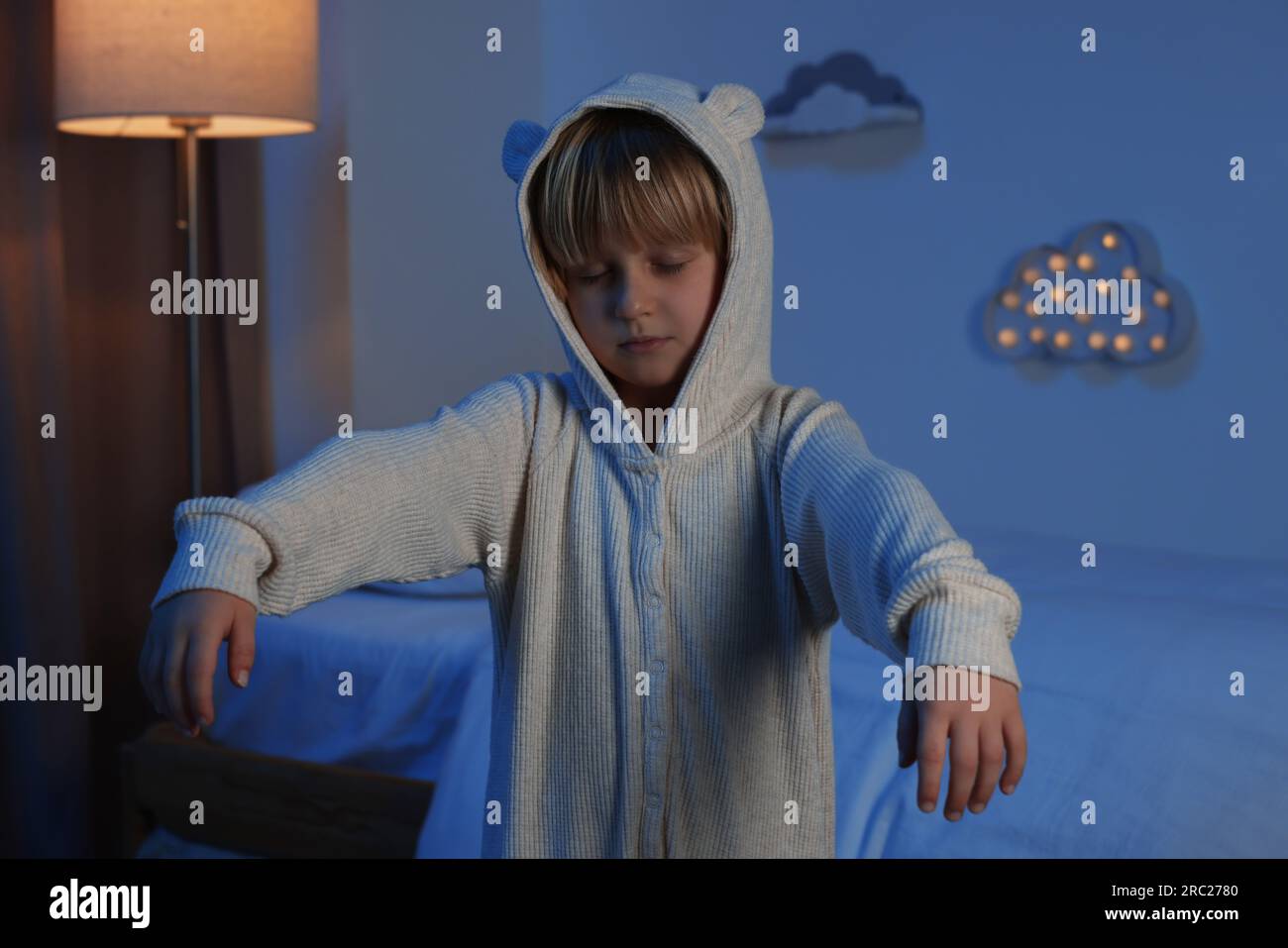 Boy in pajamas sleepwalking indoors at night Stock Photo Alamy