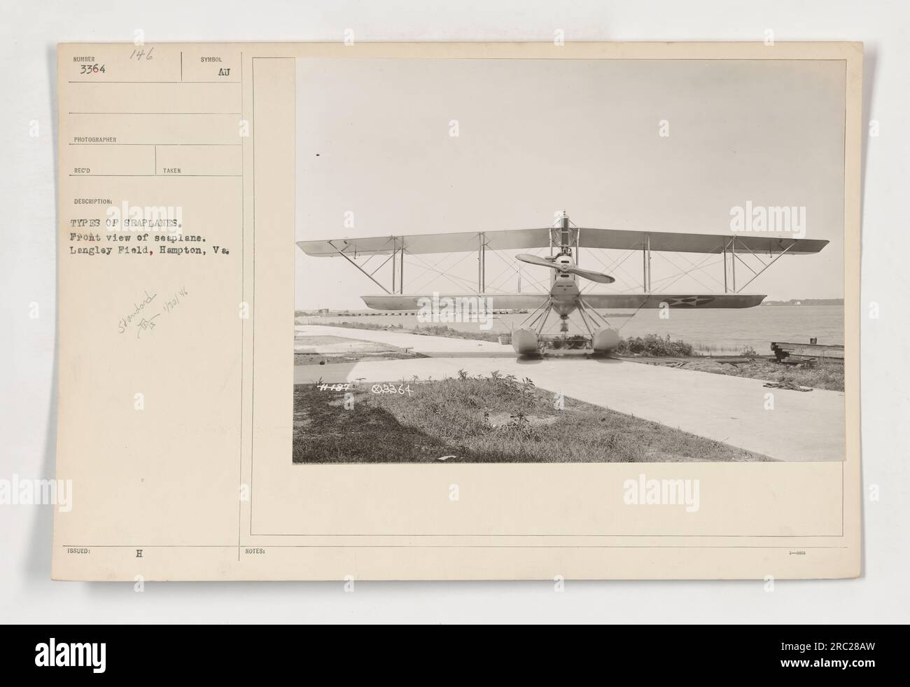 Front view of a seaplane at Langley Field in Hampton, VA. This image captures one of the different types of seaplanes used during World War One. The photograph is labelled as 3364 and was taken by photographer RECO. It is part of a collection of photographs of American military activities during the war. Stock Photo