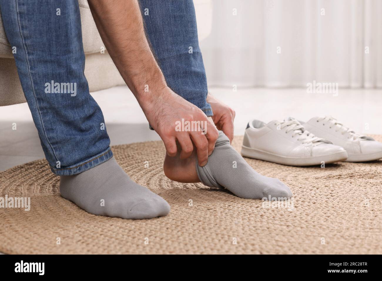 Person wearing grey socks hi-res stock photography and images - Alamy