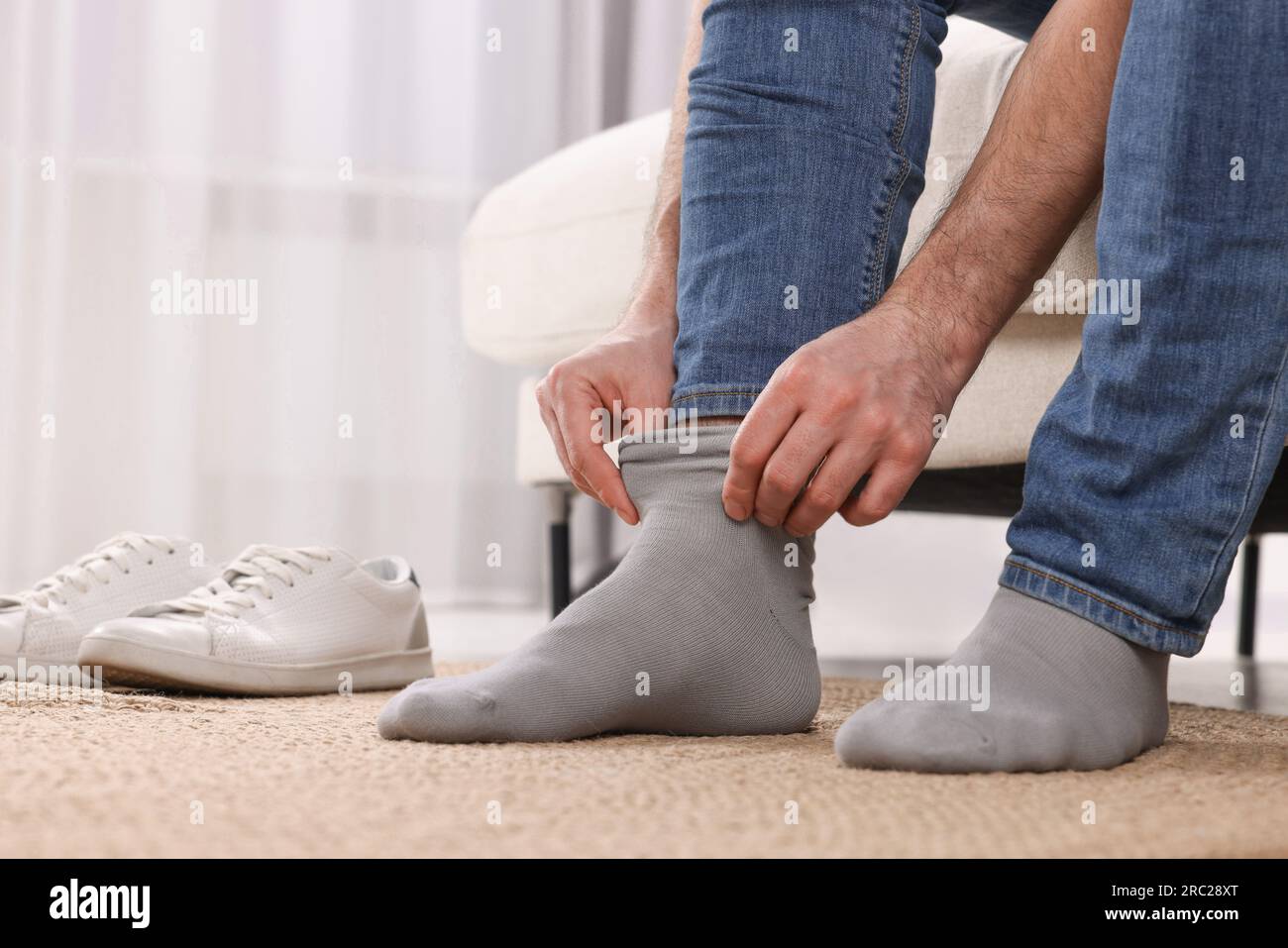 Person wearing grey socks hi-res stock photography and images - Alamy