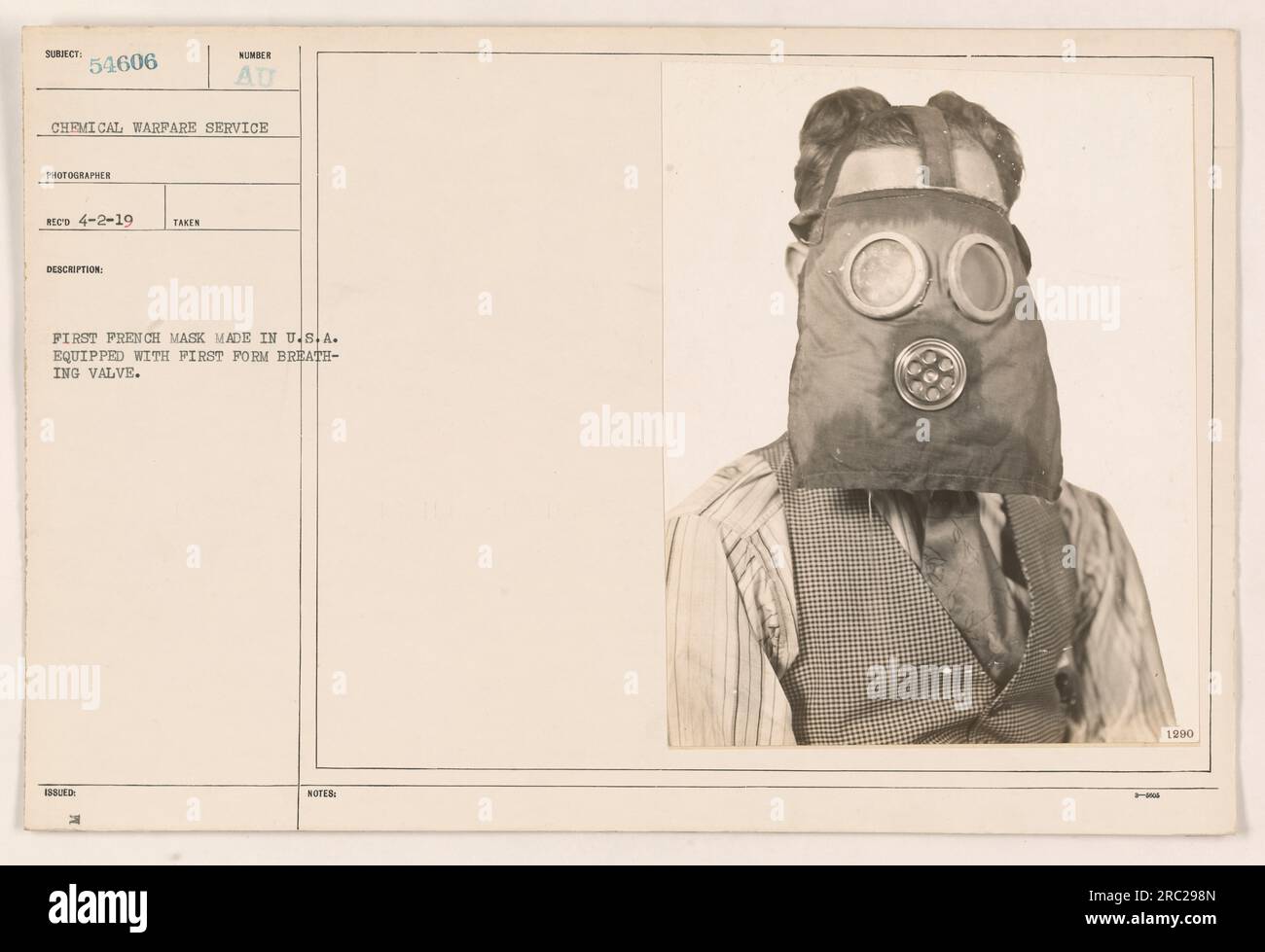 Image showing the first French gas mask manufactured in the United States equipped with the first iteration of a breathing valve. This development took place on April 2, 1919. The event was documented by a Chemical Warfare Service photographer under the subject number 54606. Stock Photo