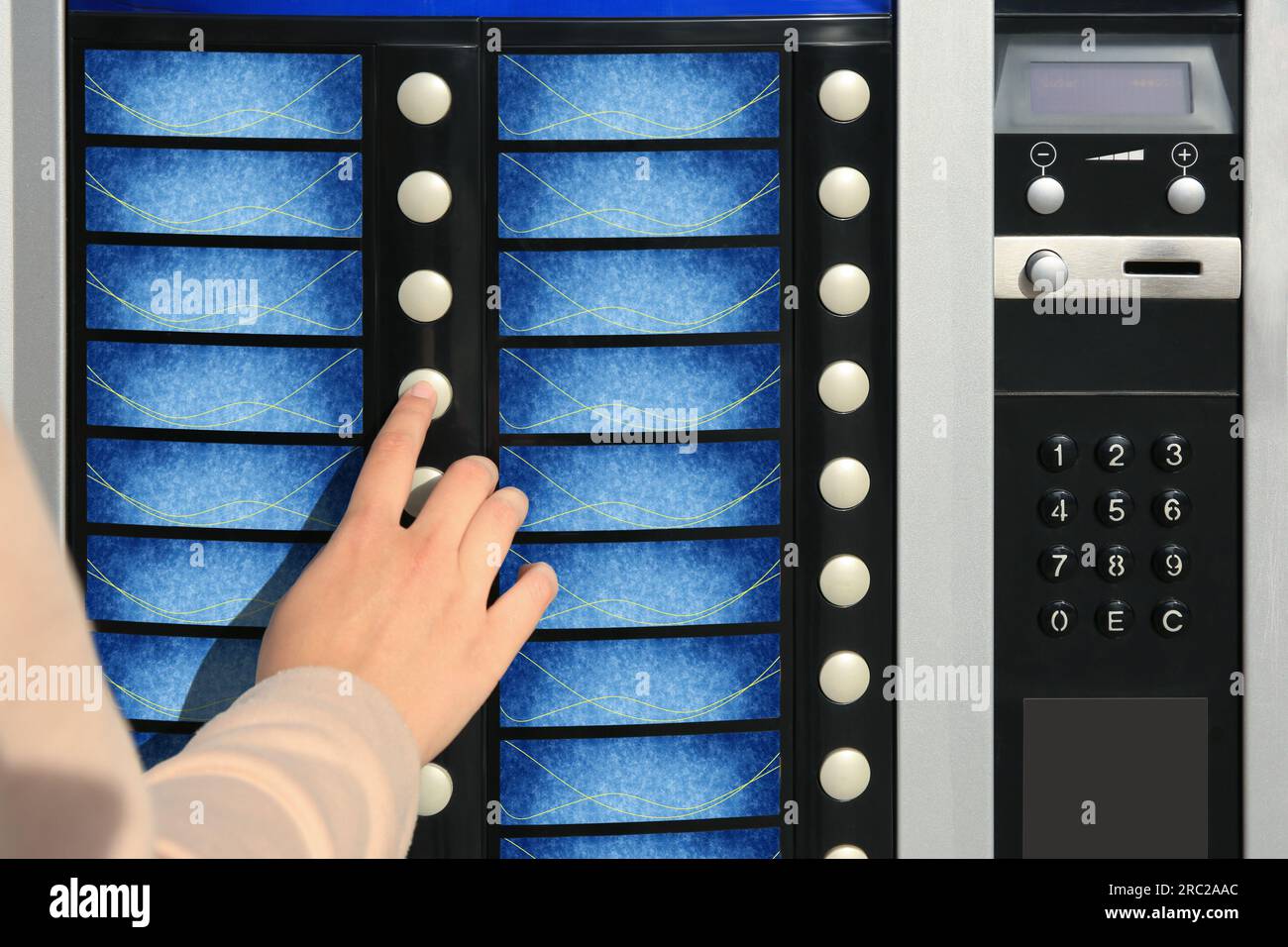Using coffee vending machine. Woman pressing button to choose drink