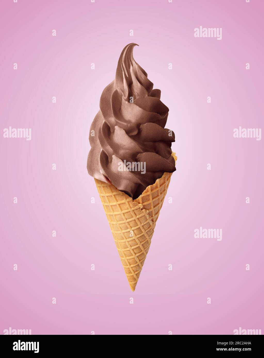 Delicious soft serve chocolate ice cream in crispy cone on pastel