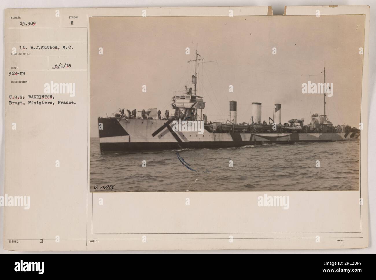 American soldiers disembark from the U.S.S. Warrinton in Brest, Finistere, France during World War I. Lieutenant A. J. Sutton of the Signal Corps captured this image on June 1, 1918. The soldiers are seen exiting the ship, preparing for their military activities in the war. Stock Photo