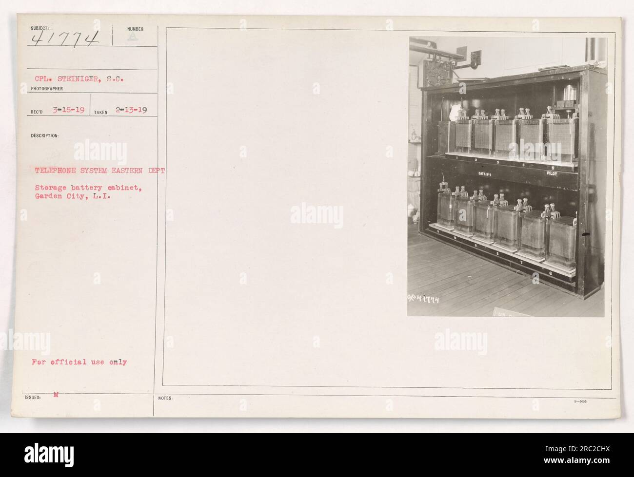 Cpl. Steiniger, S.C. photographer, captures an image of a storage battery cabinet used for the telephone system in the Eastern Department. The location is at Garden City, Long Island. The cabinet is designated for official use only. This photograph is a Record Copy taken on February 13th, 1919, with the description number 41774. Stock Photo