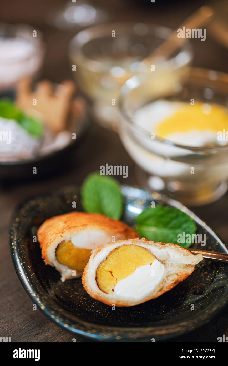 The dessert with sweet white cream Egg Yolk Stock Photo - Alamy