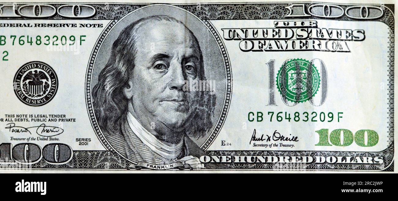 Large fragment of the obverse side of 100 one hundred dollar banknote currency series 2001 with the portrait of president Benjamin Franklin, vintage r Stock Photo