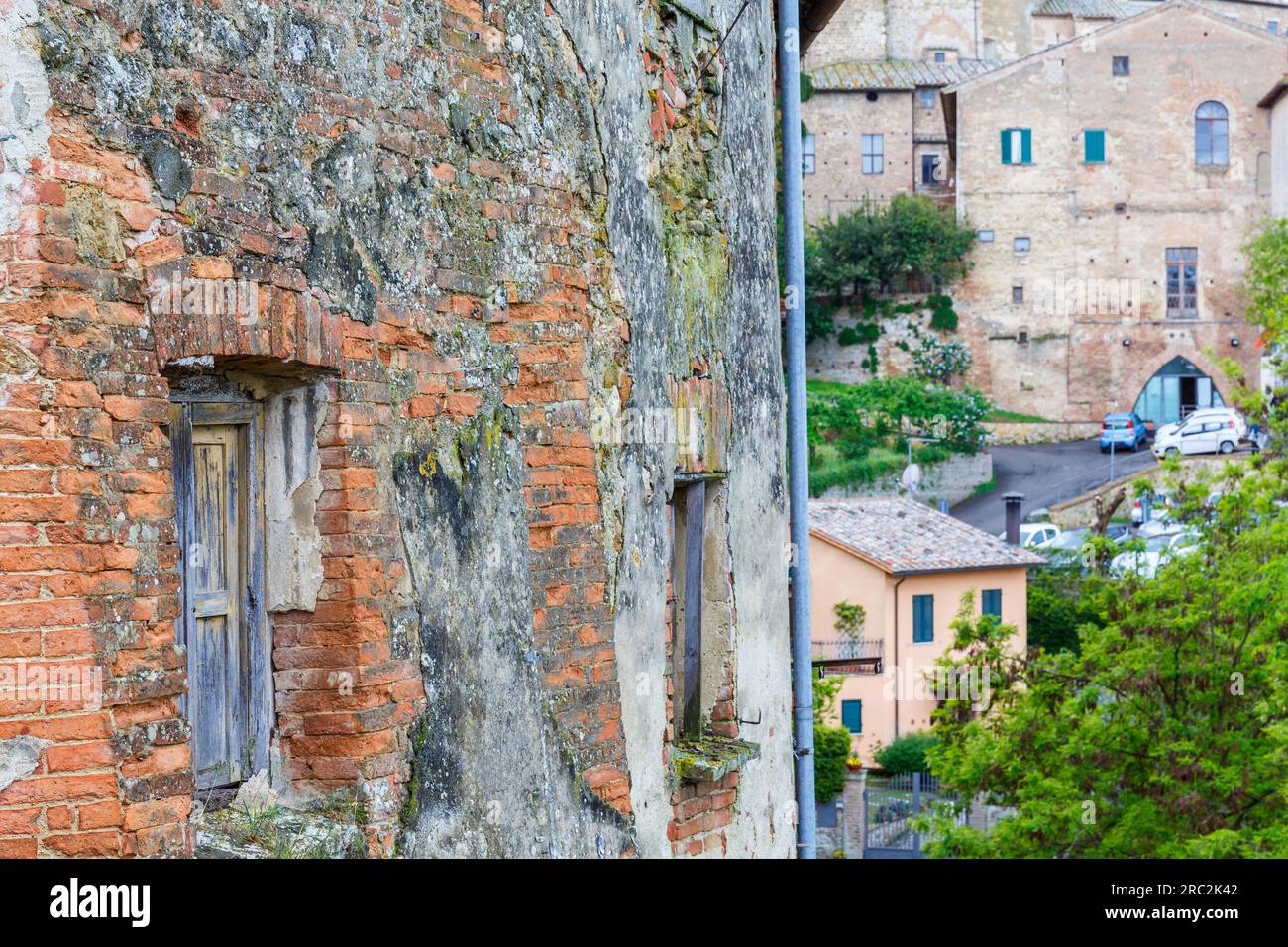 Old weathered window on a brick wall Stock Photo