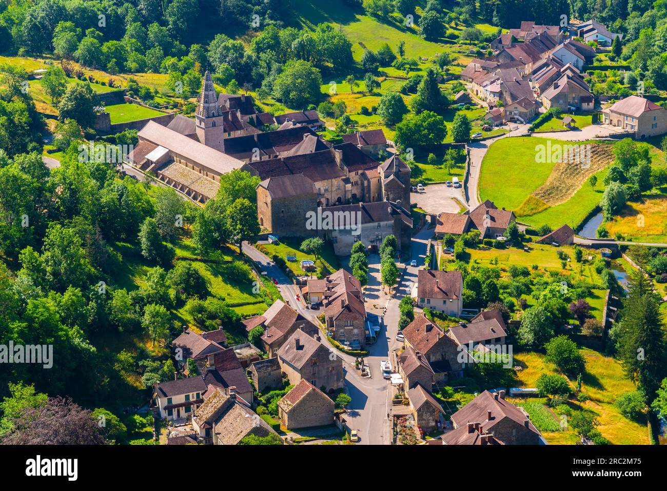 Aerial view over small and beautiful Baume Les Messieurs village nestled in the valley of Jura mountains. Jura department of Franche-Comte, France. Stock Photo