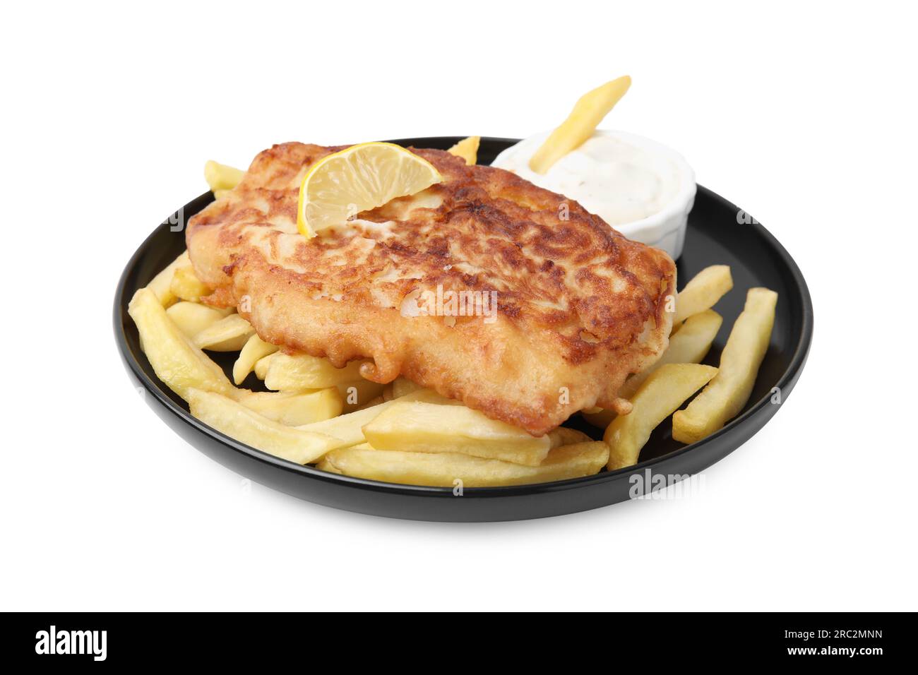 Tasty fish in soda water batter, potato chips, sauce and lemon slice