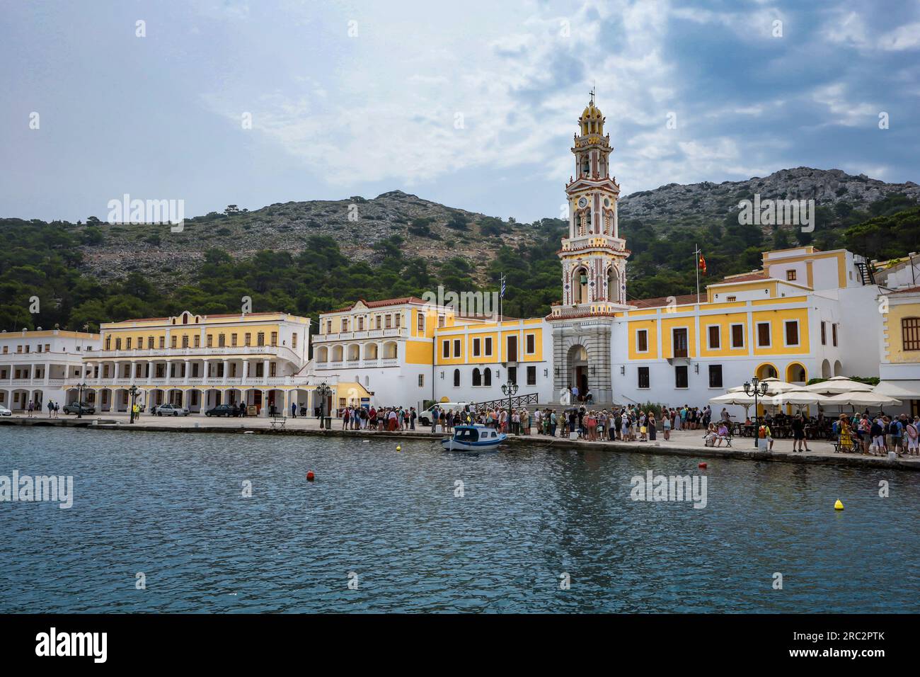 Symi, Greece - May 30, 2023:  Monastery of Archangel Michael on the sea front of Panormitis village. Stock Photo