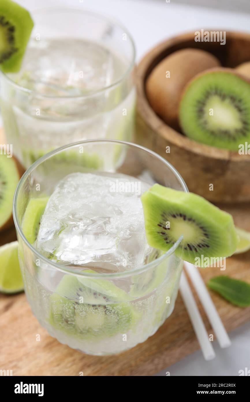 Refreshing drink with kiwi and ice on table Stock Photo