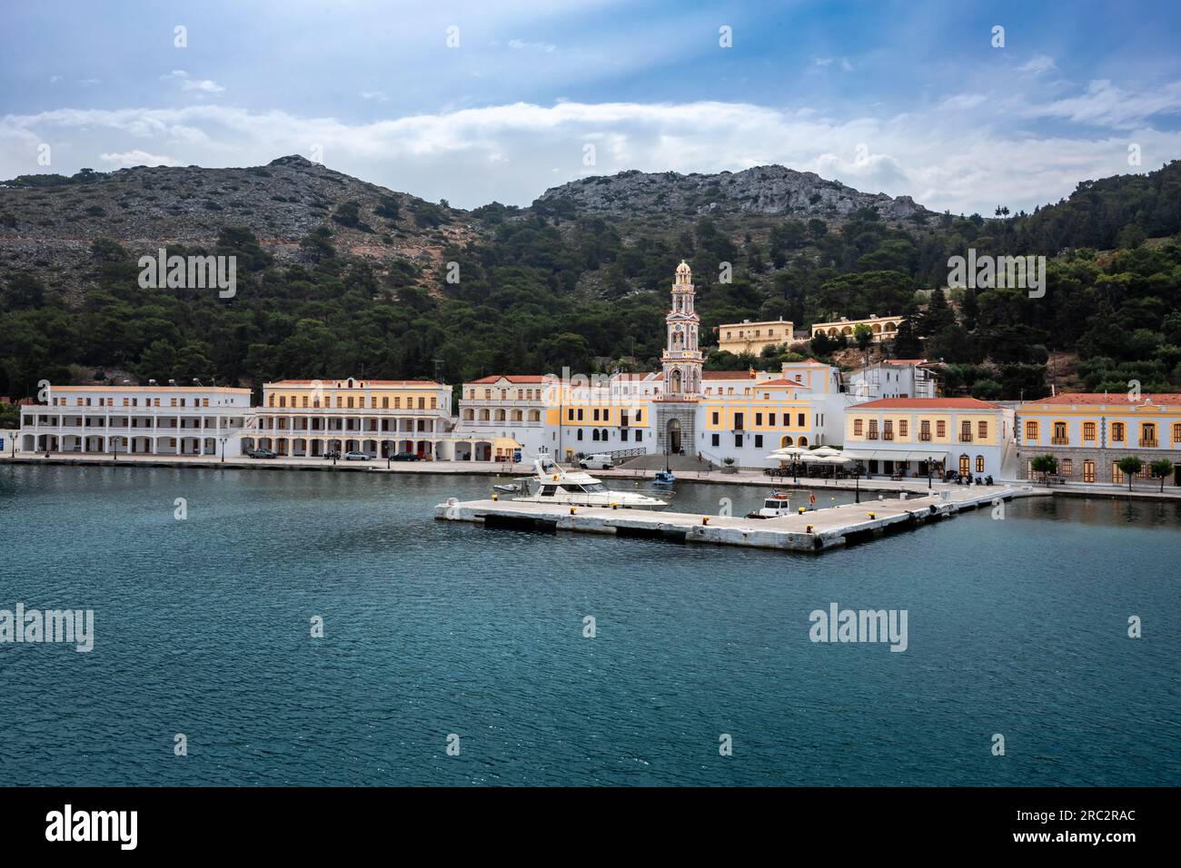 Symi, Greece - May 30, 2023:  Monastery of Archangel Michael on the sea front of Panormitis village. Stock Photo