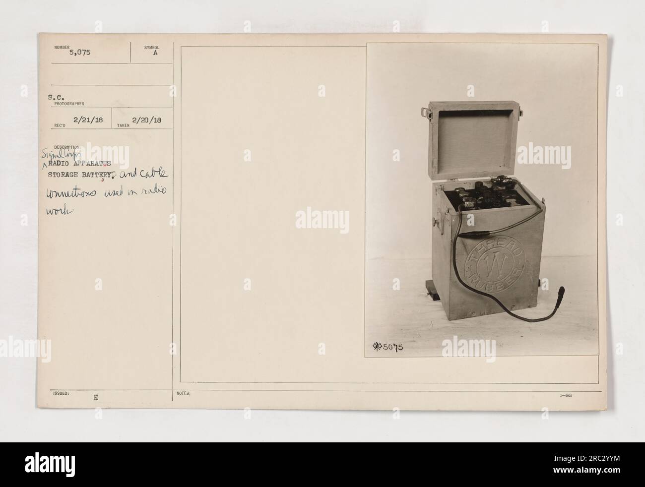 Figure 111-SC-5075 depicts a storage battery and cable connections used in radio work during World War One. This photo was taken on February 21, 1918, in Mexico. The image shows a close-up of the apparatus used for radio communication, including the battery and its associated cables. Stock Photo
