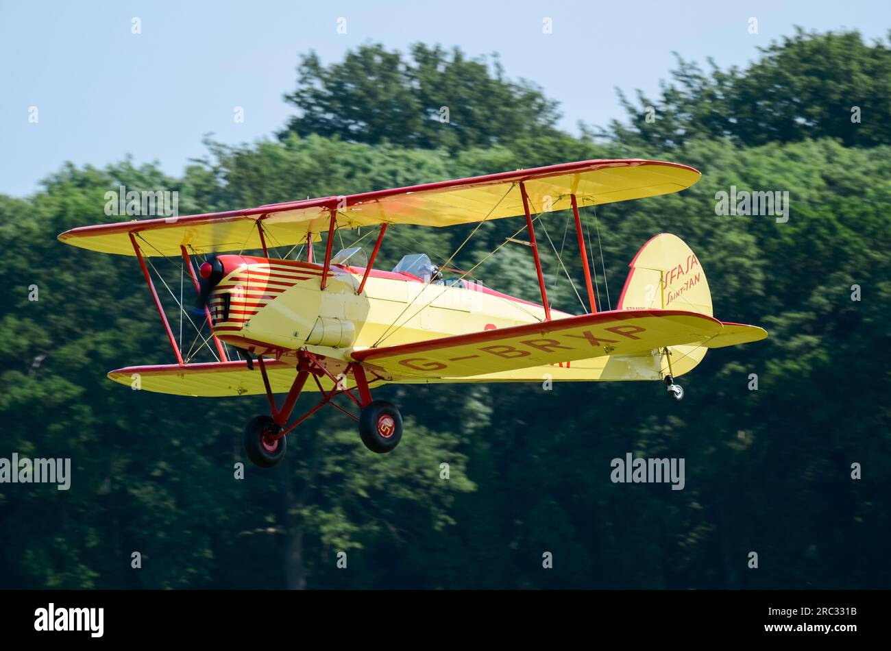 Stampe-Vertongen SV-4B plane G-BRXP taking off from fly-in event in the countryside at Heveningham Hall. Rural country in Suffolk Stock Photo