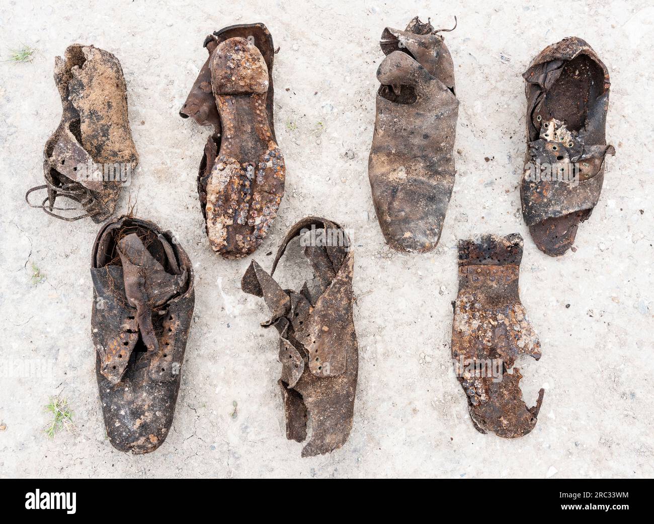 A collection of Victorian footwear buried under the earth floor of a Joiners workshop to ward off evil spirits or bring good luck, East Yorkshire, UK Stock Photo