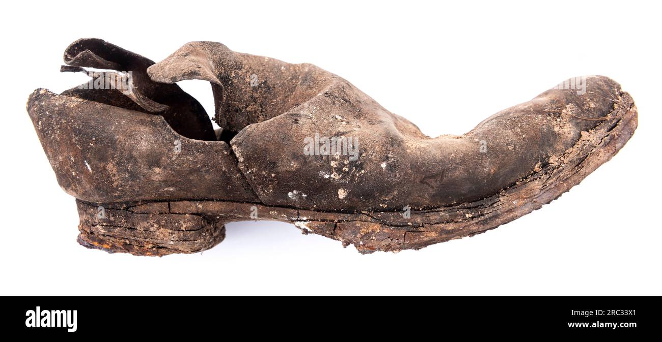 One of a cache of Victorian shoes buried under the earth floor of a Joiners workshop to ward off evil spirits or bring good luck, East Yorkshire, UK Stock Photo