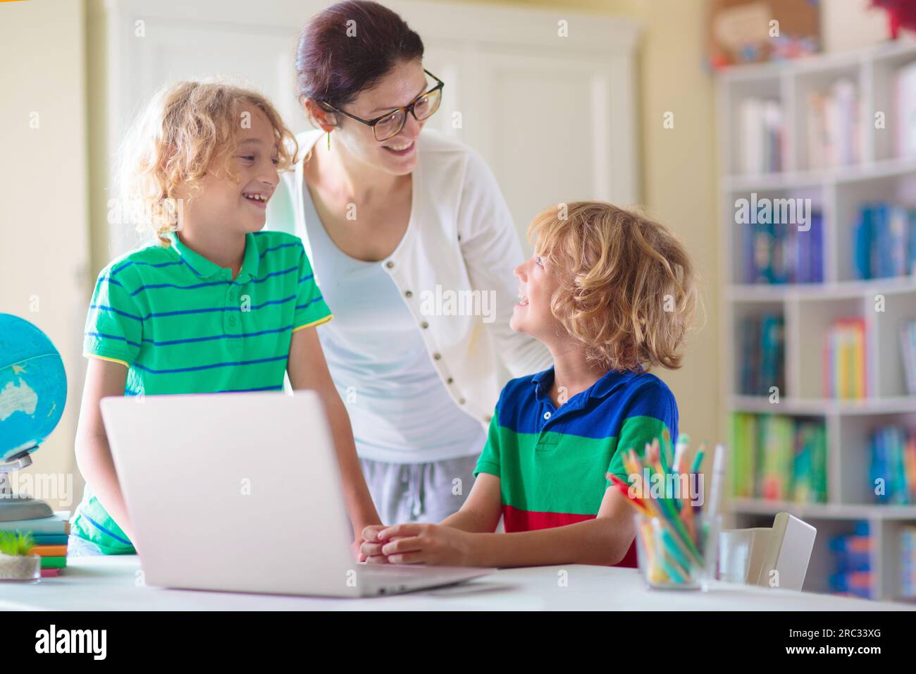 Child doing homework on computer. Online class. Homeschooling and ...