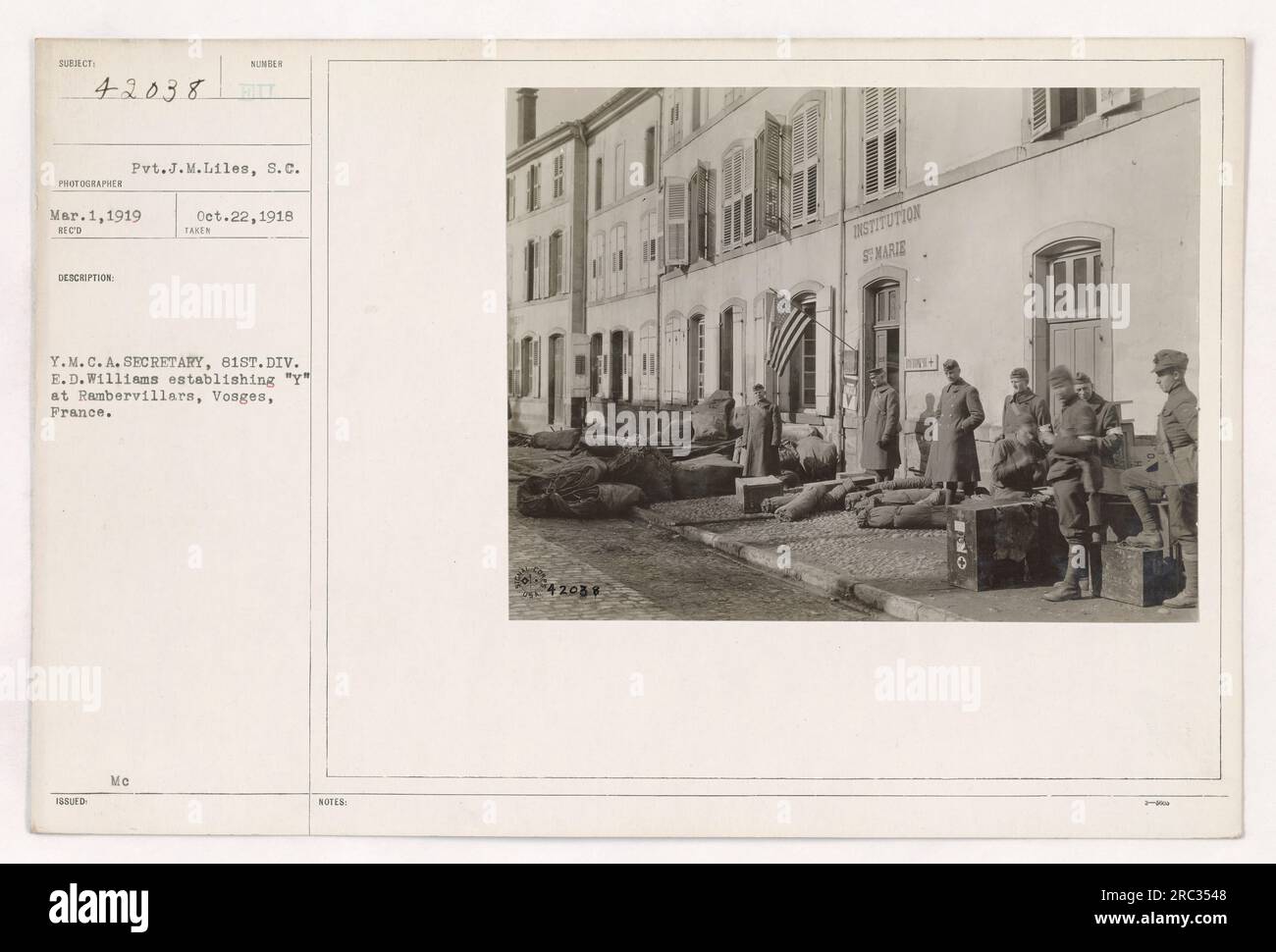 Private J.M. Liles of the Signal Corps is seen in this photograph from March 1, 1919. The image captures Y.M.C.A. Secretary E.D. Williams working to establish a 'Y' facility in Rambervillars, Vosges, France, for the 81st Division. Stock Photo