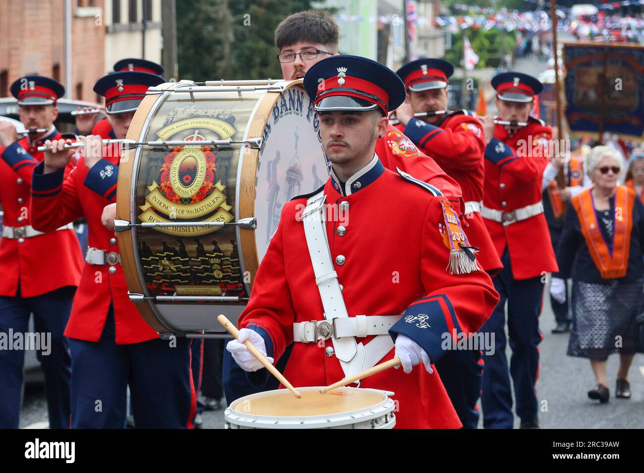 Lurgan, County Armagh, Northern Ireland.12 Jul 2023. The Twelfth of July is marked by Orange Order parades across Northern Ireland. Lurgan District left their headquarters at Brownlow House before parading up the town to the war memorial ahead of the main County Armagh demonstration being held in the town this year.The parades across Northern Ireland mark the victory of William of Orange over James at the Battle of the Boyne in 1690. Credit: CAZIMB/Alamy Live News. Stock Photo