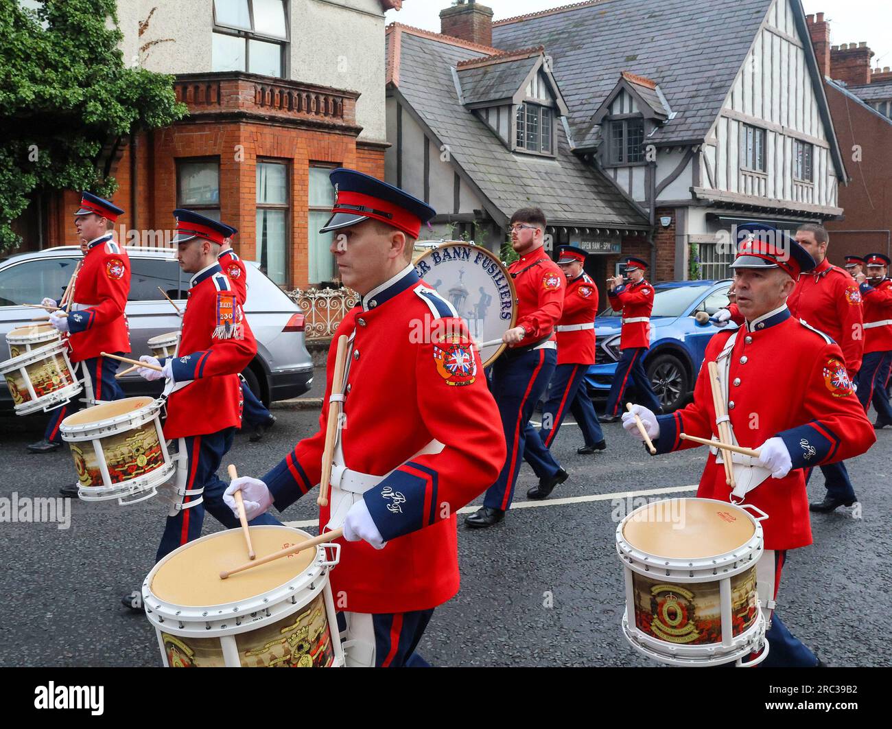 Lurgan, County Armagh, Northern Ireland.12 Jul 2023. The Twelfth of July is marked by Orange Order parades across Northern Ireland. Lurgan District left their headquarters at Brownlow House before parading up the town to the war memorial ahead of the main County Armagh demonstration being held in the town this year.The parades across Northern Ireland mark the victory of William of Orange over James at the Battle of the Boyne in 1690. Credit: CAZIMB/Alamy Live News. Stock Photo